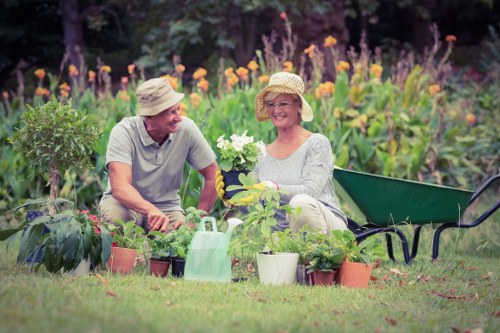 Professional landscapers working in a lush Perivale garden