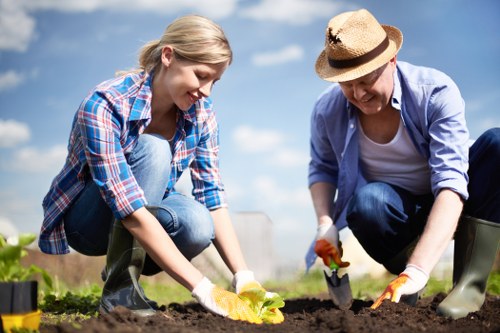 Skilled landscaper planning design with garden blueprint in Slade Green