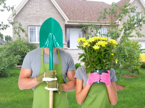 Experienced landscapers cleaning a patio surface